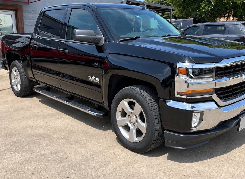 Black Chevrolet Silverado after collision repair, refinished and reassembled at the First Class Auto facility